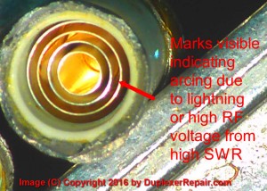 Pitting and burn marks were visible on microscopic inspection of the cylindrical plates inside this failed capacitor.
